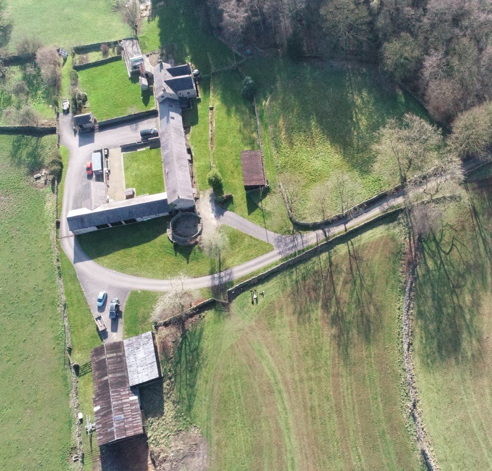 Aerial photograph of farm buildings and associated land.